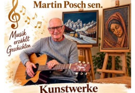 An older man sits with a guitar and smiles. In the background, two paintings and music symbols can be seen.