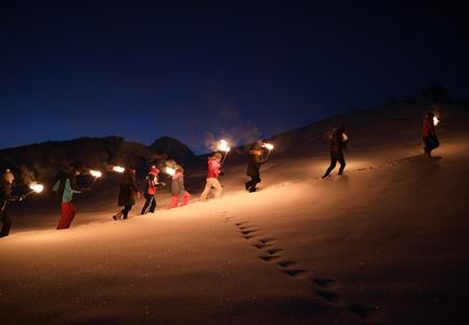 Shimmering torchlit walk