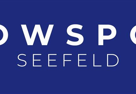 A simple logo with the text "SNOWSPORT SEEFELD" on a blue background. It conveys the focus on winter sports in Seefeld.