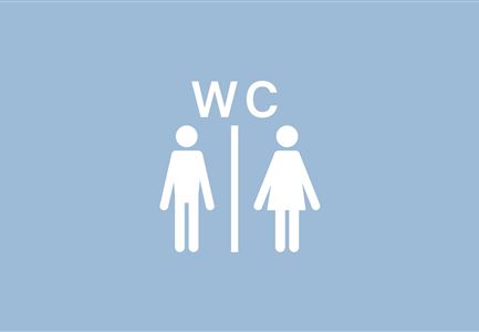 Ein einfaches Schild für die Toiletten. Es zeigt ein Männchen und ein Weibchen in weiß auf blauem Hintergrund.