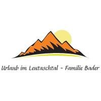 The logo features stylized mountains in orange and black with a sun in the background. Below it is the text "Vacation in Leutaschtal - Family Bader".