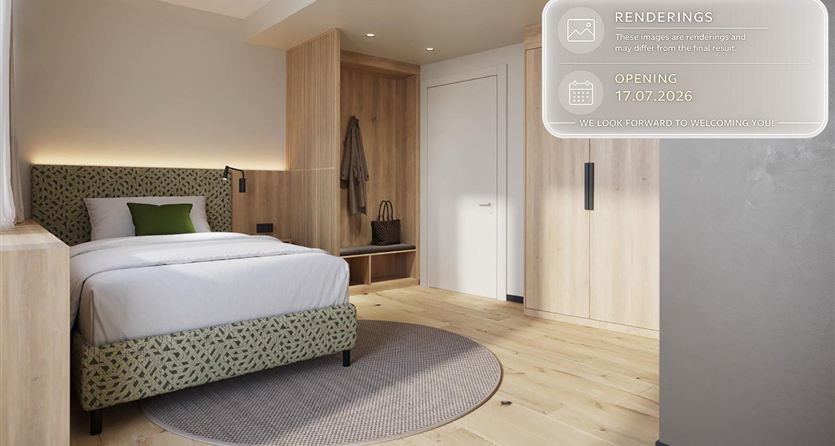 Una camera da letto moderna con un letto singolo e un tappeto accogliente. Le pareti sono chiare e ci sono dettagli in legno che creano un'atmosfera calda.